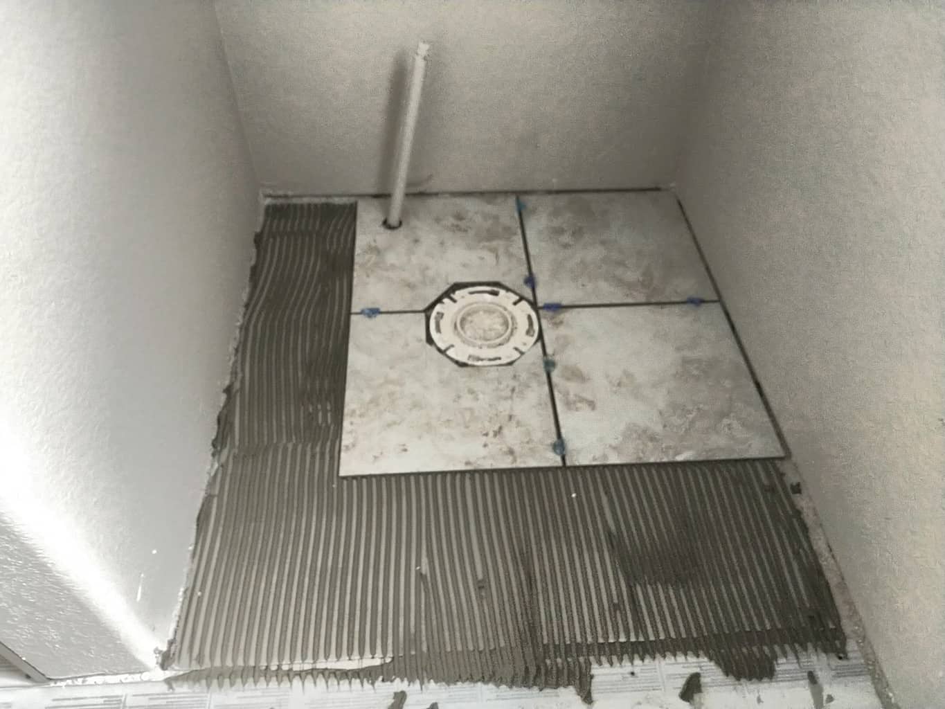 Tiles are installed around the toilet