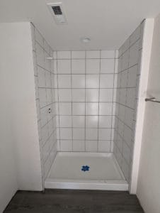 Basement shower grouted and finished