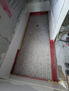 Part of walls installed and shower floor installed