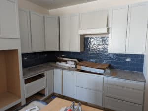 Rest of kitchen backsplash set except for going up to hood