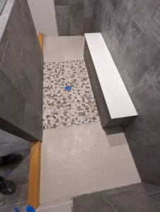 Sides demo'd, curbs installed, and slope installed on each side of shower floor