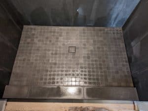 Master shower floor and tile-in drain grouted