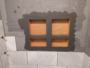 Niches laid out and installed in basement tub surround