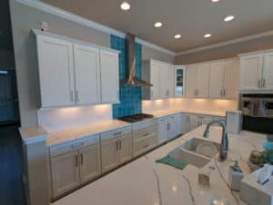 Backsplash grouted, outlets reinstalled, and faceplates on