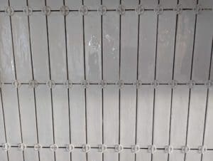 Closeup of tiles in vertical straight lay