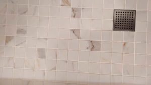 Couple of tiles sticking up in this shower floor2