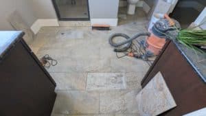 Tiles demo'd and floor scraped