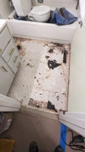 Black adhesive under vinyl tiles could be asbestos - can't demo more