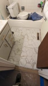 Guest bath floor is grouted, caulked, and finished