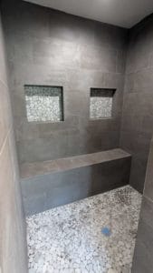 Master shower grouted, caulked, and finished