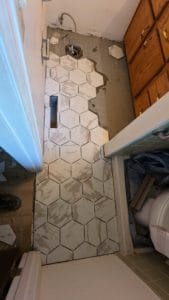 Tile partially installed in master bath