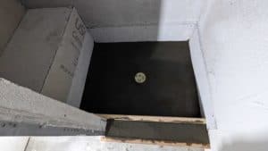 Basement shower pan poured