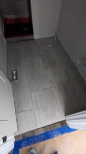 Main level guest bath floor grouted