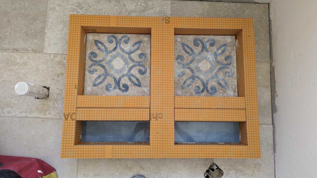 Niches modified and back accent tiles installed