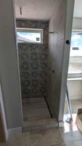 Master shower grouted and finished