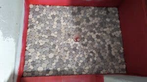 Pebbles installed on guest shower floor