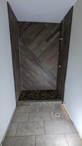 Basement shower finished minus granite curb