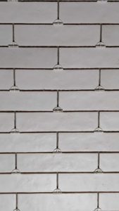 Closeup of basement tub surround tiles