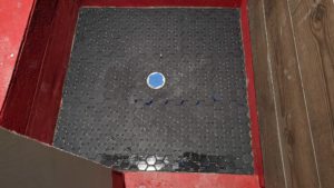 Master shower floor hexagons installed