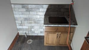 Powder room wainscot grouted and finished