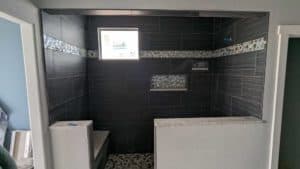 The grouted and finished master shower