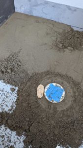 Making drain height match thickness of floor material - pebbles