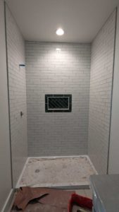 Guest shower surround grouted and finished