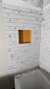 Niche installed and tiled around