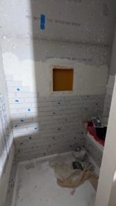 Niche installed and starting to set more tile around