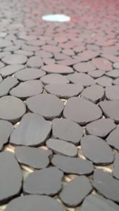 Closeup of pebbles on master shower floor