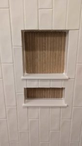 Grouted, caulked, and finished niche