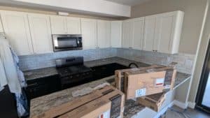 Basement kitchen backsplash grouted and finished