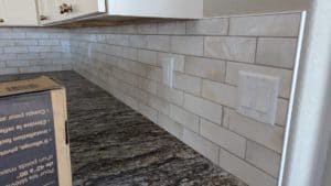 Basement kitchen backsplash grouted and finished2