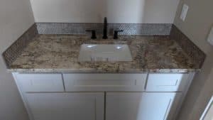 Powder room backsplash installed