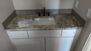 Powder room backsplash grouted and finished