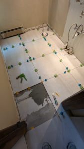 Setting last tile in bathroom