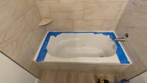 Tub surround grouted, caulked, and finished3