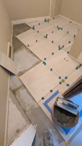 Most of the tile installed in the master closet