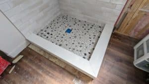 Grouted, caulked, finished shower floor