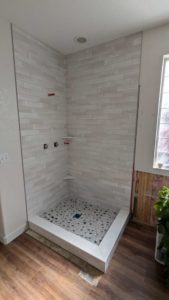 Grouted, caulked, finished master shower