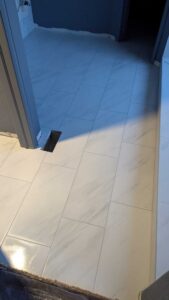 Master bath floor grouted and finished