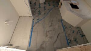 Most of master bath floor installed