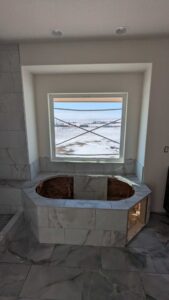 Master tub deck, skirt, and surround finished