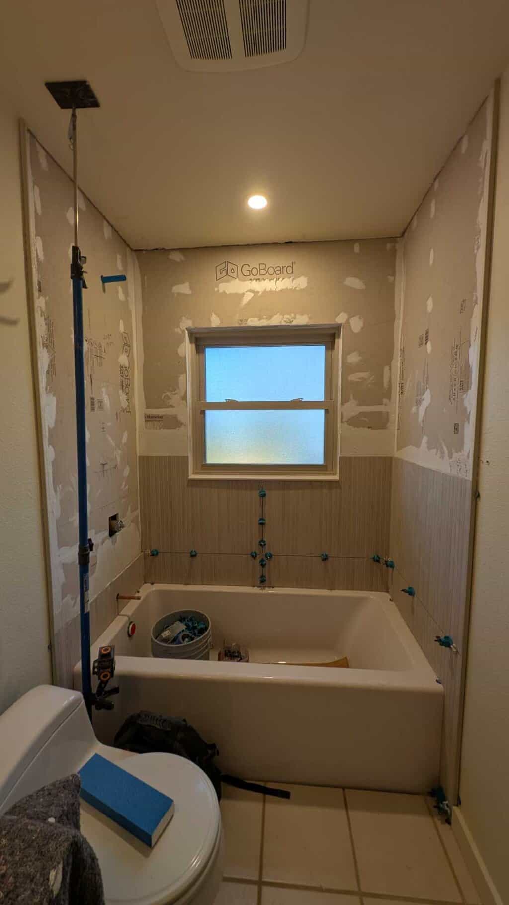 Part of tub surround installed Part of tub surround installed