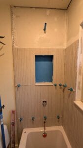 Tile installed around niche and sill installed