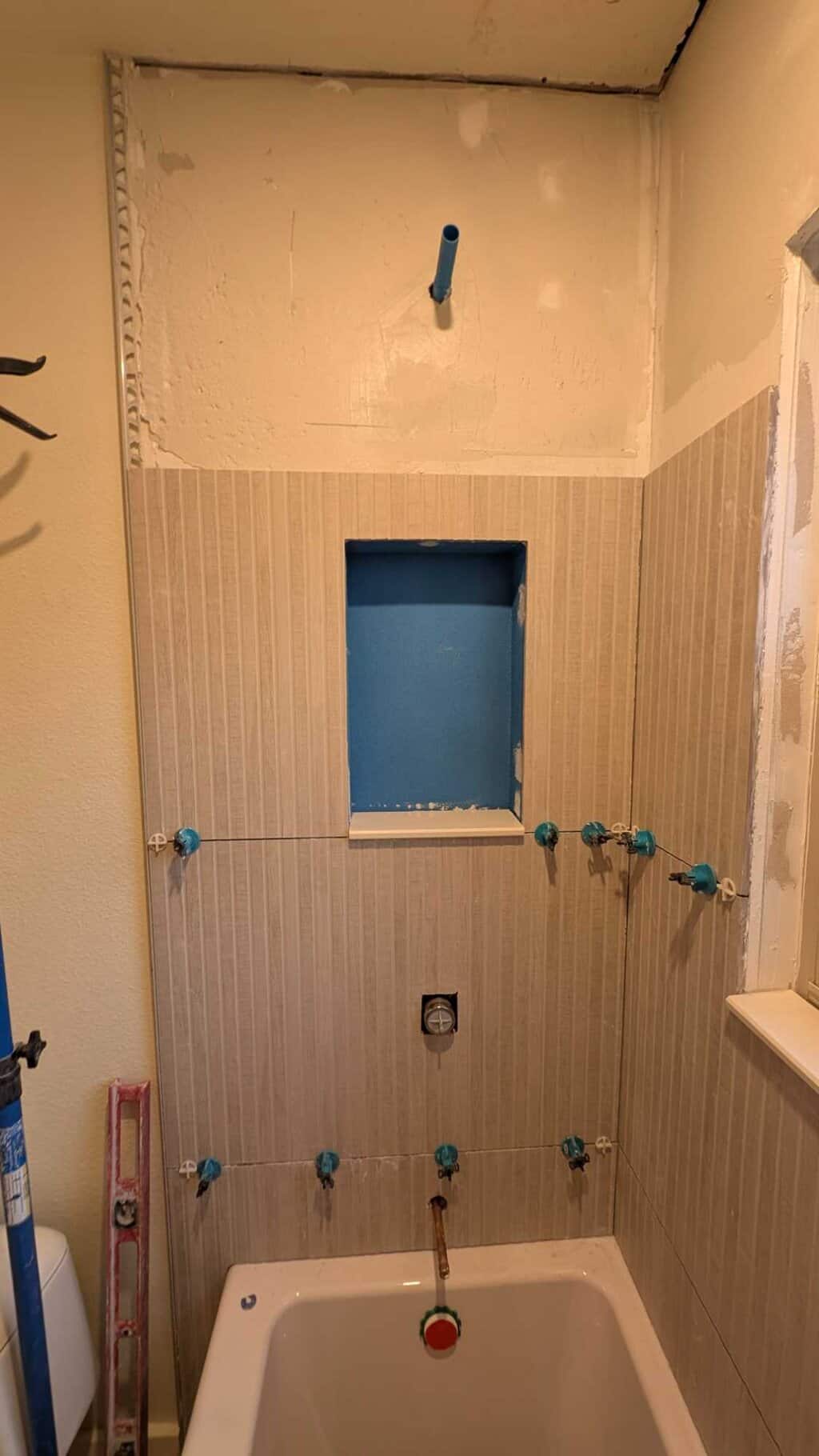 Tile installed around niche and sill installed Tile installed around niche and sill installed