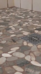Shower floor pebbles closeup