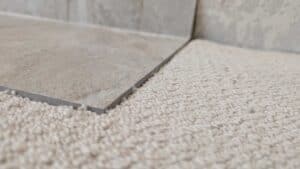 Carpet installers made no effort to try to match the height of the tile