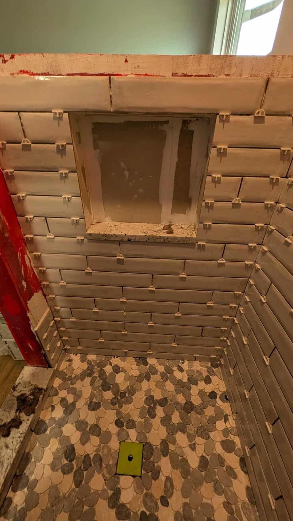 Tile around niche and sill installed