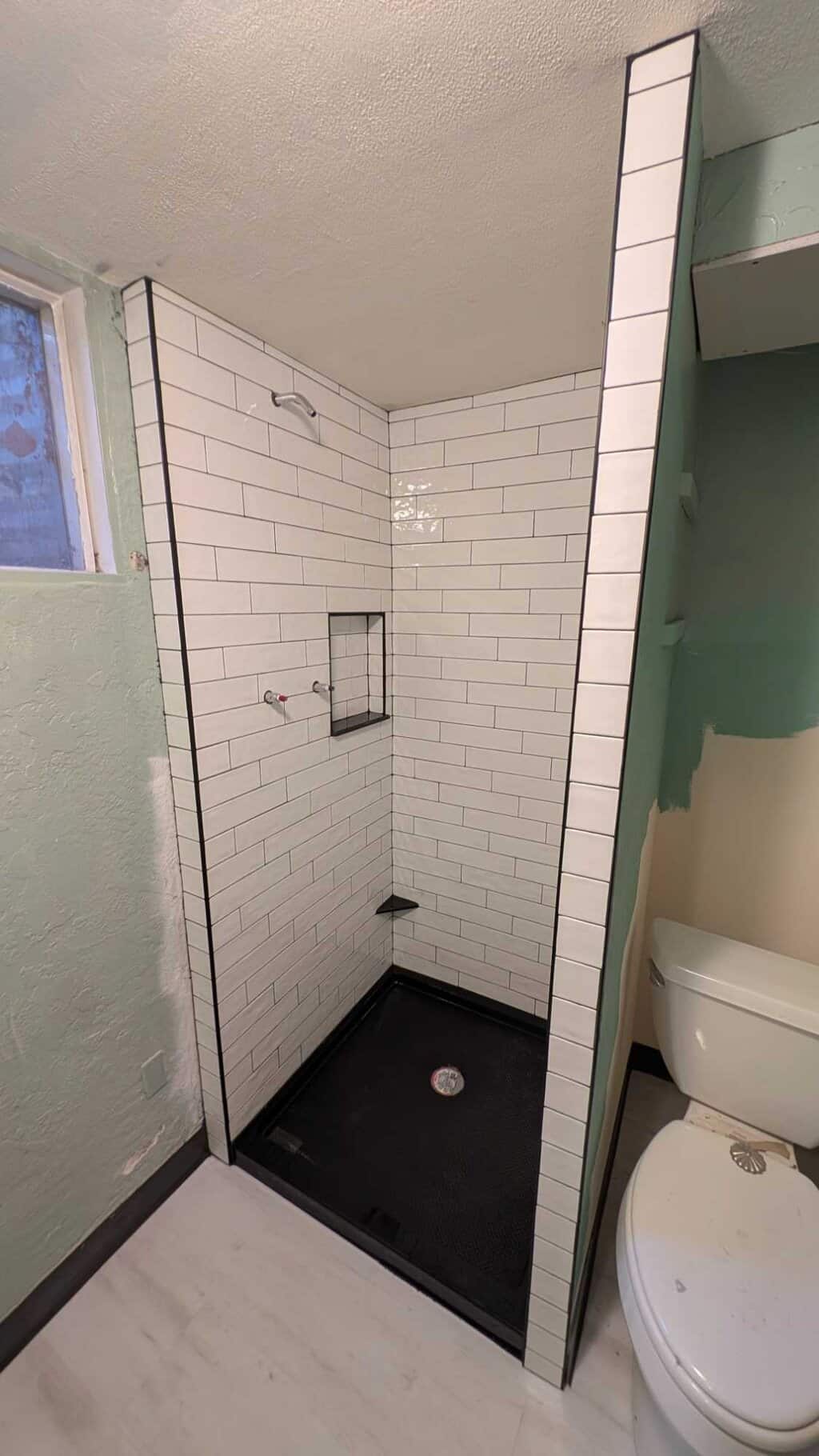 Basement shower grouted and finished